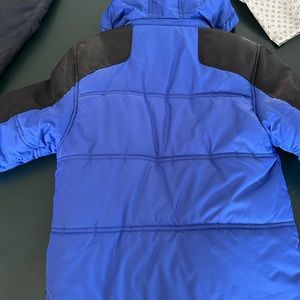Kids Jacket. Bright blue, size 10/12, zip up with hood.